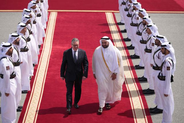 Qatar's Minister of State Muhammed Al Khulaifi bids farewell to Britain's Prime Minister Keir Starmer at the airport in Doha, Qatar on April 10, 2026. (Photo by Alastair Grant / POOL / AFP)