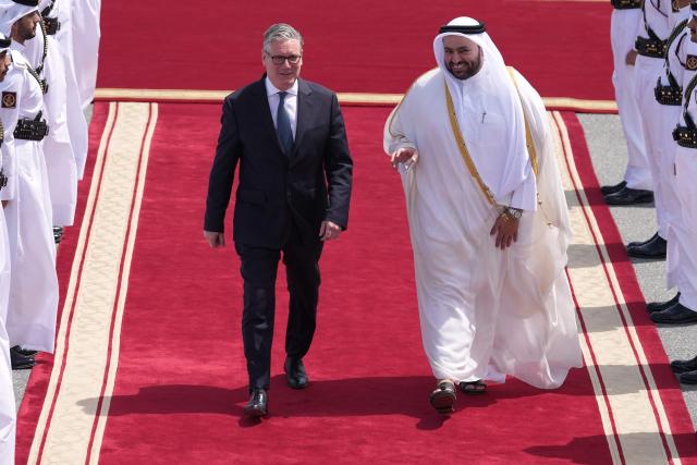 Qatar's Minister of State Muhammed Al Khulaifi bids farewell to Britain's Prime Minister Keir Starmer at the airport in Doha, Qatar on April 10, 2026. (Photo by Alastair Grant / POOL / AFP)