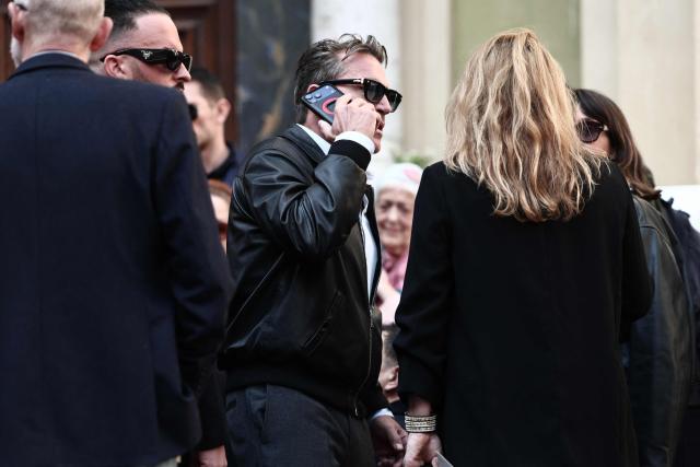 French TV host Benjamin Castaldi (C) leaves after attending the funeral ceremony of Loana Petrucciani, the first reality TV star in France, at the cathedral of Sainte-Reparate in Nice, southeastern France where she was found dead at her home at the age of 48, on April 10, 2026. (Photo by Thibaud MORITZ / AFP)