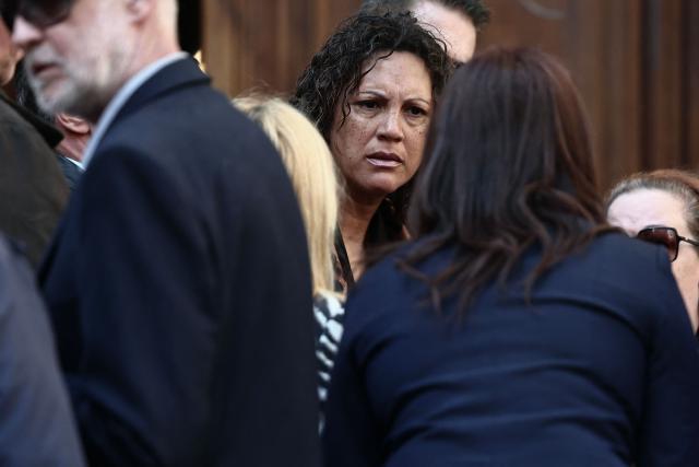 Loft Story ex-competitor Julie Mercy (C) leaves after attending the funeral ceremony of Loana Petrucciani, the first reality TV star in France, at the cathedral of Sainte-Reparate in Nice, southeastern France where she was found dead at her home at the age of 48, on April 10, 2026. (Photo by Thibaud MORITZ / AFP)