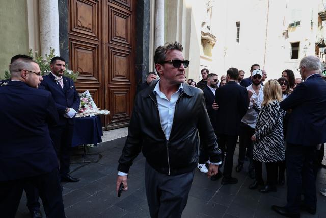 French TV host Benjamin Castaldi (C) leaves after attending the funeral ceremony of Loana Petrucciani, the first reality TV star in France, at the cathedral of Sainte-Reparate in Nice, southeastern France where she was found dead at her home at the age of 48, on April 10, 2026. (Photo by Thibaud MORITZ / AFP)
