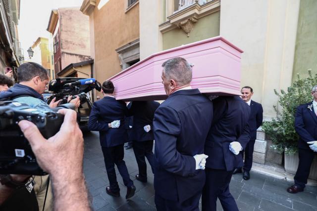 The coffin of Loana Petrucciani, the first reality TV star in France, leaves the cathedral of Sainte-Reparate at the end of her funeral ceremony in Nice, southeastern France where she was found dead at her home at the age of 48, on April 10, 2026. (Photo by Thibaud MORITZ / AFP)