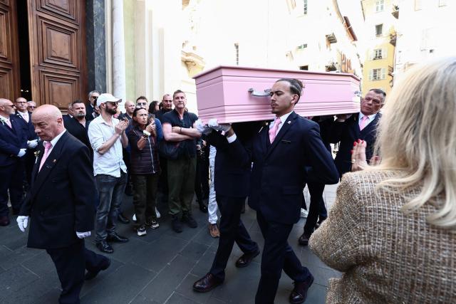 The coffin of Loana Petrucciani, the first reality TV star in France, is applauded as it leaves the cathedral of Sainte-Reparate at the end of her funeral ceremony in Nice, southeastern France where she was found dead at her home at the age of 48, on April 10, 2026. (Photo by Thibaud MORITZ / AFP)