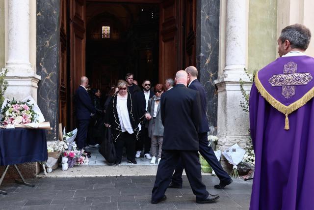 Violette Petrucciani (C), mother of Loana, leaves after attending the funeral ceremony of Loana Petrucciani, the first reality TV star in France, at the cathedral of Sainte-Reparate in Nice, southeastern France where she was found dead at her home at the age of 48, on April 10, 2026. (Photo by Thibaud MORITZ / AFP)