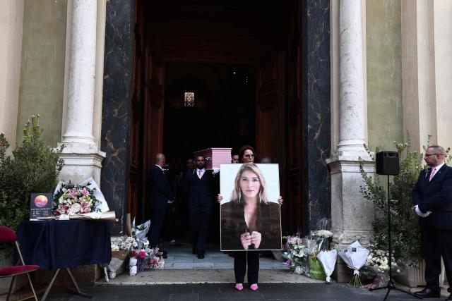 The coffin of Loana Petrucciani, the first reality TV star in France, leaves the cathedral of Sainte-Reparate at the end of her funeral ceremony in Nice, southeastern France where she was found dead at her home at the age of 48, on April 10, 2026. (Photo by Thibaud MORITZ / AFP)
