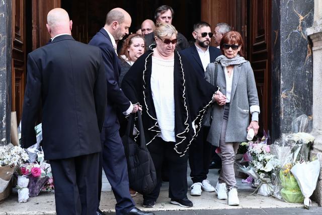 Violette Petrucciani (C), mother of Loana, leaves after attending the funeral ceremony of Loana Petrucciani, the first reality TV star in France, at the cathedral of Sainte-Reparate in Nice, southeastern France where she was found dead at her home at the age of 48, on April 10, 2026. (Photo by Thibaud MORITZ / AFP)