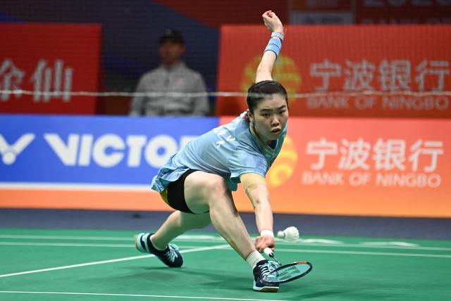 China's Gao Fangjie hits a return to Japan's Akane Yamaguchi during their women's singles quarter final match at the Badminton Asia Championship in Ningbo, eastern China's Zhejiang province on April 10, 2026. (Photo by CN-STR / AFP) / China OUT