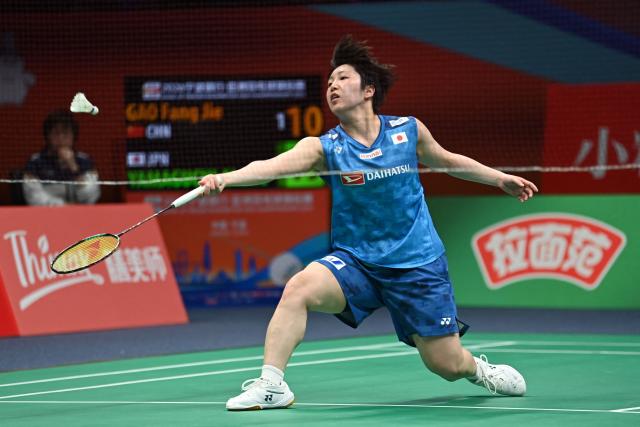 Japan's Akane Yamaguchi hits a return to China's Gao Fang Jie during their women's singles quarter final match at the Badminton Asia Championship in Ningbo, eastern China's Zhejiang province on April 10, 2026. (Photo by CN-STR / AFP) / China OUT