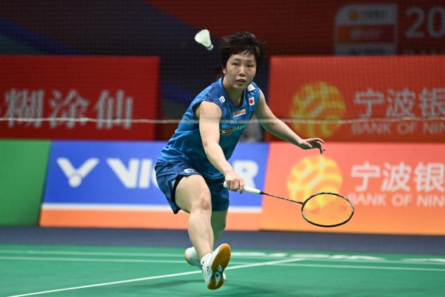 Japan's Akane Yamaguchi hits a return to China's Gao Fang Jie during their women's singles quarter final match at the Badminton Asia Championship in Ningbo, eastern China's Zhejiang province on April 10, 2026. (Photo by CN-STR / AFP) / China OUT
