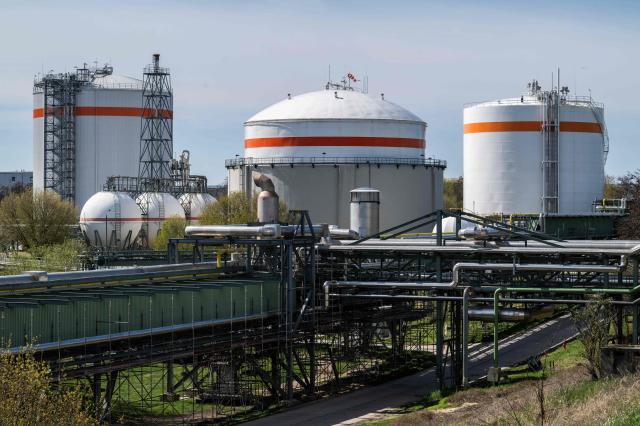 A photo shows ammonia storage tanks at the SKW Piesteritz agro-chemical plant in Piesteritz near Wittenberg, northern Germany, on April 9, 2026. SKW Piesteritz is Germany’s largest producer of ammonia and urea with an annual output of over four million tonnes, manufacturing both a wide range of industrial chemicals and agrochemical products. (Photo by John MACDOUGALL / AFP)