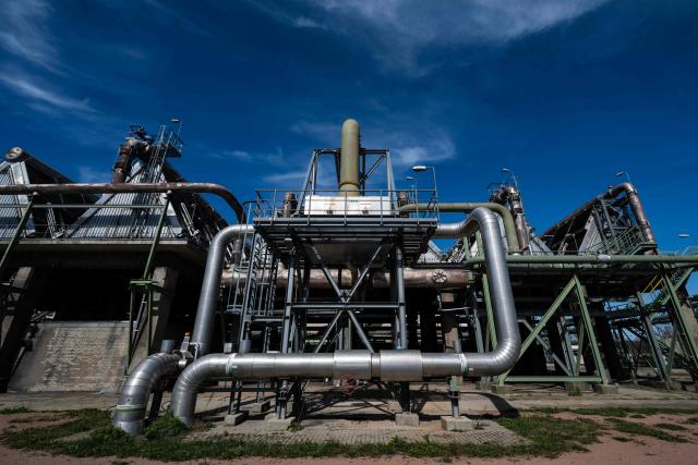 An outside view shows the ammonia production facility at the SKW Piesteritz agro-chemical plant in Piesteritz near Wittenberg, northern Germany, on April 9, 2026. SKW Piesteritz is Germany’s largest producer of ammonia and urea with an annual output of over four million tonnes, manufacturing both a wide range of industrial chemicals and agrochemical products. (Photo by John MACDOUGALL / AFP)