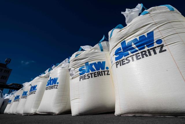Bulk bags containing fertilizer await transport at the SKW Piesteritz agro-chemical plant in Piesteritz near Wittenberg, northern Germany, on April 9, 2026. SKW Piesteritz is Germany’s largest producer of ammonia and urea with an annual output of over four million tonnes, manufacturing both a wide range of industrial chemicals and agrochemical products. (Photo by John MACDOUGALL / AFP)