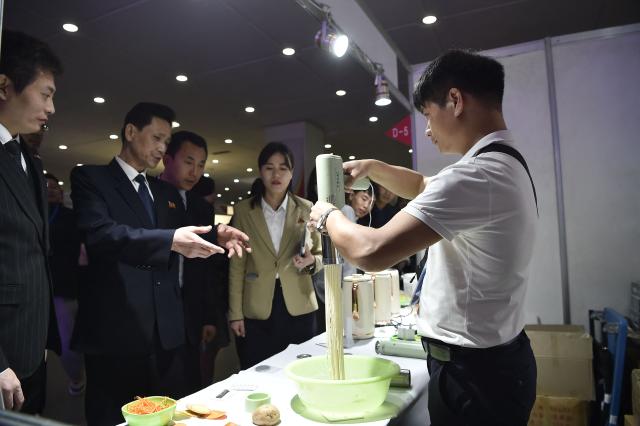 Visitors browse around the Pyongyang International Tourist Souvenirs and Health Goods Exhibition at the Sci-Tech Complex in Pyongyang on April 10, 2026. (Photo by KIM Won Jin / AFP)