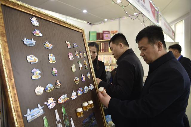 Visitors browse around the Pyongyang International Tourist Souvenirs and Health Goods Exhibition at the Sci-Tech Complex in Pyongyang on April 10, 2026. (Photo by KIM Won Jin / AFP)