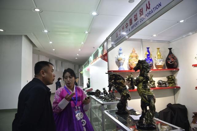 Visitors browse around the Pyongyang International Tourist Souvenirs and Health Goods Exhibition at the Sci-Tech Complex in Pyongyang on April 10, 2026. (Photo by KIM Won Jin / AFP)