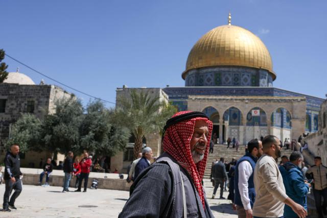 Muslims walk in the grounds of the Dome of the Rock at the Al-Aqsa Mosque compound during Friday noon prayers, following 40 days of closure by the Israeli authorities, in Jerusalem's Old City on April 10, 2026. The Al-Aqsa Mosque was reopened to Muslim worshippers on April 9, 2026, following a 40-day closure since the US-Israel war with Iran began on February 28. Jerusalem's Old City contains major holy sites for all three Abrahamic religions, which had been shuttered since the start of the war sparked by the US-Israeli attack on Iran. (Photo by AHMAD GHARABLI / AFP) / 