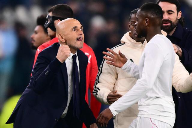 (FILES) Juventus' Italian coach Luciano Spalletti celebrates with Juventus' French defender #15 Pierre Kalulu Kyatengwa after winning the UEFA Champions League - league phase day 6 football match between Juventus and Pafos FC at the Allianz stadium in Turin, on December 10, 2025. Luciano Spalletti will stay on as Juventus coach after signing a new two-year deal, the Serie A club announced on April 10, 2026. (Photo by Marco BERTORELLO / AFP)