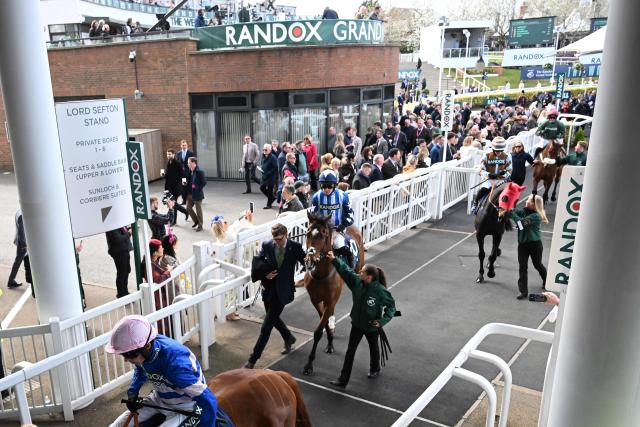 Horses prepare for the opening race on day two of the Grand National Festival horse race meeting at Aintree Racecourse in Liverpool, north-west England, on April 10, 2026. (Photo by Paul ELLIS / AFP)