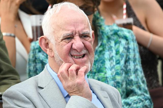 A racegoer reacts while watching the opening race on day two of the Grand National Festival horse race meeting at Aintree Racecourse in Liverpool, north-west England, on April 10, 2026. (Photo by Paul ELLIS / AFP)