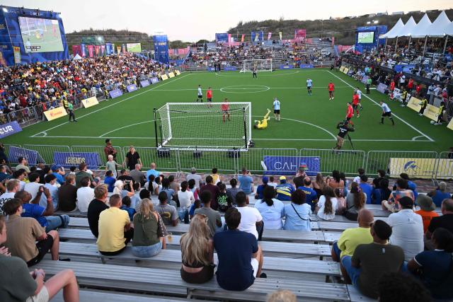Football fans attend the Legends Football Tournament match between Argentina and Portugal, in Willemstad, Curacao, in the Dutch Caribbean, on April 9, 2026. (Photo by Raul ARBOLEDA / AFP)
