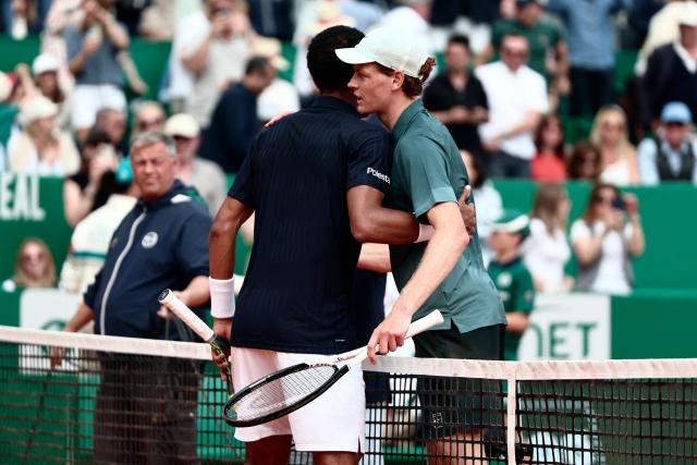 Italy's Jannik Sinner shakes hands with Canada's Felix Auger-Aliassime following their Monte Carlo ATP Masters Series Tournament quarter final tennis match on Court Rainier III at the Monte-Carlo Country Club in Roquebrune-Cap-Martin, south-eastern France on April 10, 2026. (Photo by Thibaud MORITZ / AFP)