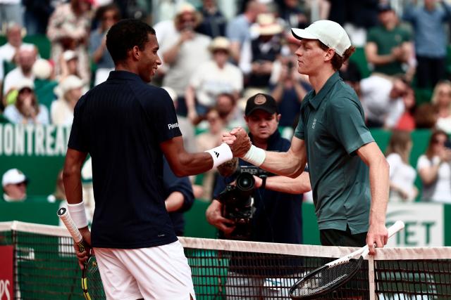 Italy's Jannik Sinner shakes hands with Canada's Felix Auger-Aliassime following their Monte Carlo ATP Masters Series Tournament quarter final tennis match on Court Rainier III at the Monte-Carlo Country Club in Roquebrune-Cap-Martin, south-eastern France on April 10, 2026. (Photo by Thibaud MORITZ / AFP)