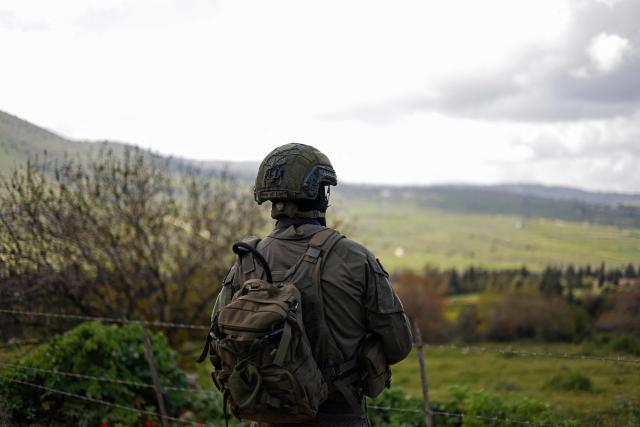 An Israeli soldier patrols along the Israel-Lebanon border on April 10, 2026. The Israeli military said on April 10 that it had "dismantled" more than 4,300 Hezbollah sites in Lebanon since fighting with the militant group began last month. (Photo by Jalaa MAREY / AFP) / 