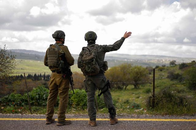 Israeli soldiers patrol along the Israel-Lebanon border on April 10, 2026. The Israeli military said on April 10 that it had "dismantled" more than 4,300 Hezbollah sites in Lebanon since fighting with the militant group began last month. (Photo by Jalaa MAREY / AFP) / 