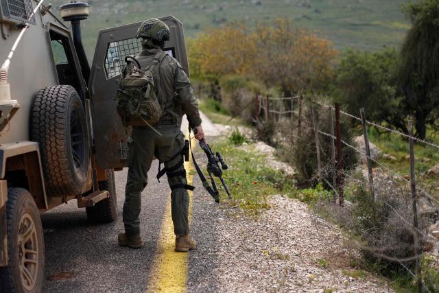 An Israeli soldier patrols along the Israel-Lebanon border on April 10, 2026. The Israeli military said on April 10 that it had "dismantled" more than 4,300 Hezbollah sites in Lebanon since fighting with the militant group began last month. (Photo by Jalaa MAREY / AFP) / 