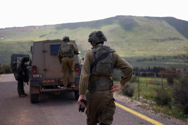 Israeli soldiers patrol along the Israel-Lebanon border on April 10, 2026. The Israeli military said on April 10 that it had "dismantled" more than 4,300 Hezbollah sites in Lebanon since fighting with the militant group began last month. (Photo by Jalaa MAREY / AFP) / 
