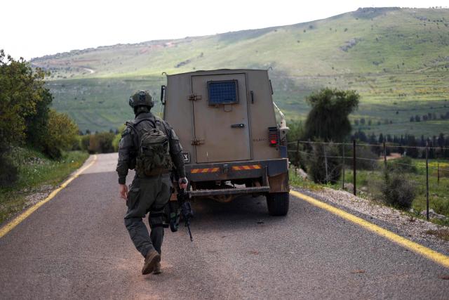 An Israeli soldier patrols along the Israel-Lebanon border on April 10, 2026. The Israeli military said on April 10 that it had "dismantled" more than 4,300 Hezbollah sites in Lebanon since fighting with the militant group began last month. (Photo by Jalaa MAREY / AFP) / 