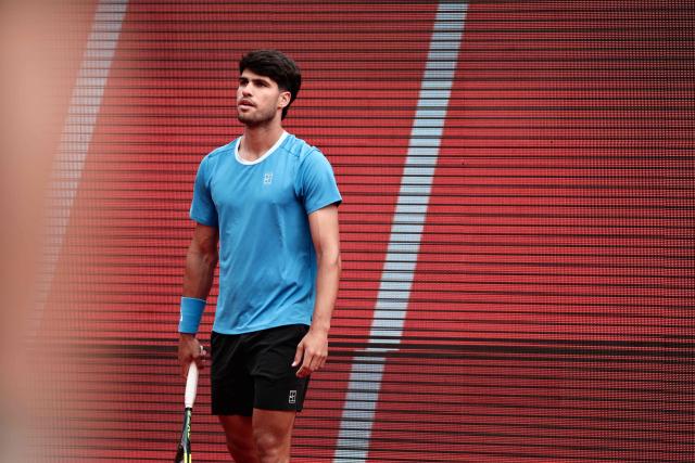 Spain's Carlos Alcaraz looks on as he plays against Kazakhstan's Alexander Bublik during the Monte Carlo ATP Masters Series Tournament quarter final tennis match on Court Rainier III at the Monte-Carlo Country Club in Roquebrune-Cap-Martin, south-eastern France on April 10, 2026. (Photo by Thibaud MORITZ / AFP)