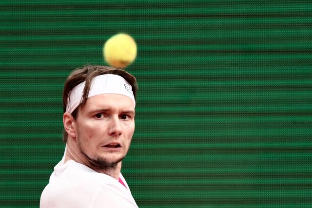 Kazakhstan's Alexander Bublik eyes the ball as he plays a backhand return to Spain's Carlos Alcaraz during the Monte Carlo ATP Masters Series Tournament quarter final tennis match on Court Rainier III at the Monte-Carlo Country Club in Roquebrune-Cap-Martin, south-eastern France on April 10, 2026. (Photo by Thibaud MORITZ / AFP)