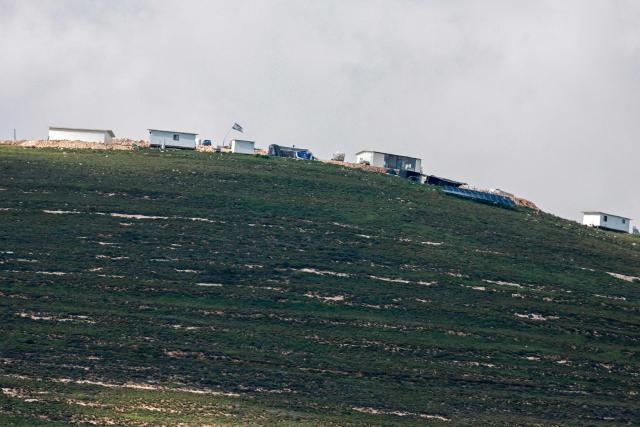 This photograph shows a view of the new mobile houses (caravans) next to an Israeli outpost in the Beit Imrin village of Nablus Governorate, in the Israeli-occupied West Bank on April 10, 2026. Israel has occupied the West Bank since 1967, and violence there has soared since the Gaza war erupted in October 2023 following Hamas's attack on Israel. Some 3,200 Palestinians from dozens of Bedouin and herding communities have been forced from their homes by settler violence and movement restrictions since October 2023, the UN's humanitarian agency OCHA reported in October. All Israeli settlements in the West Bank are considered illegal by the international community. (Photo by Jaafar ASHTIYEH / AFP)