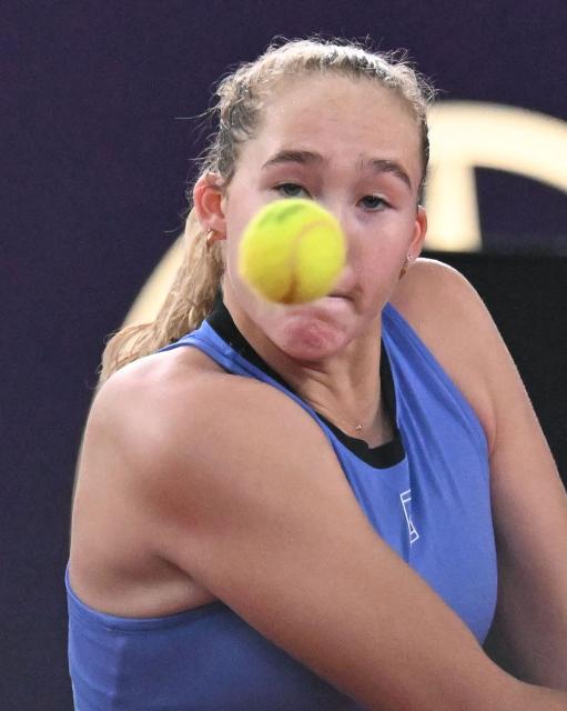 Mirra Andreeva eyes the ball during her match against Romania's Sorana Cirstea (not pictured) on the day 5 of the women's singles match of the WTA-Upper Austria Ladies Linz tennis tournament in Linz, Austria, on April 10, 2026. (Photo by BARBARA GINDL / APA / AFP) / Austria OUT