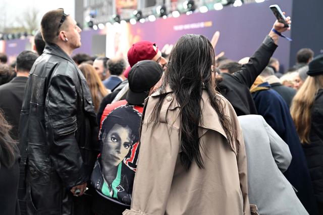 Fans wait for guests to arrive on the red carptet for the world premiere of the Michael Jackson biopic "Michael" at the Uber Eats Music Hall in Berlin on April 10, 2026. Thousands of Michael Jackson fans converged on April 10, 2026 to Berlin before the world premiere of the biopic on the king of pop, despite the accusations of paedophilia that still target the artist. (Photo by John MACDOUGALL / AFP)