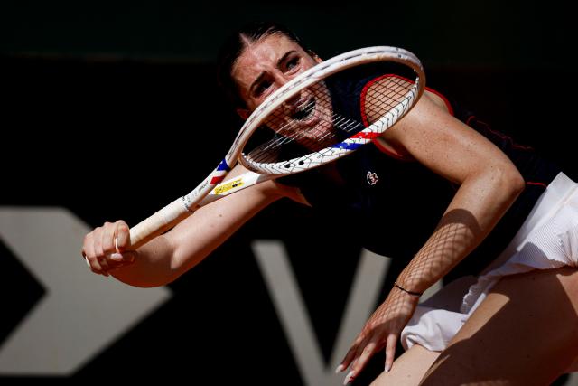 France's Elsa Jacquemot hits a return in her women's singles match against Hungary’s Anna Bondar during the Billie Jean King Cup play-offs between France and Hungary, at Oeiras on the outskirts of Lisbon, on April 10, 2026. (Photo by FILIPE AMORIM / AFP)