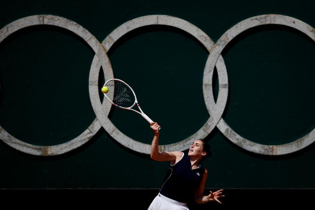 France's Elsa Jacquemot hits a return in her women's singles match against Hungary’s Anna Bondar during the Billie Jean King Cup play-offs between France and Hungary, at Oeiras on the outskirts of Lisbon, on April 10, 2026. (Photo by FILIPE AMORIM / AFP)