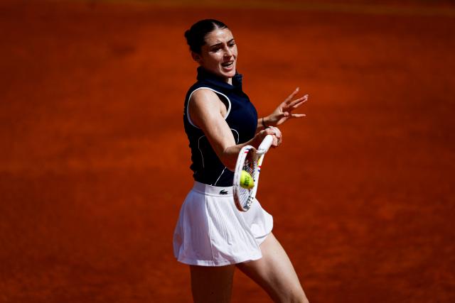 France's Elsa Jacquemot hits a return in her women's singles match against Hungary’s Anna Bondar during the Billie Jean King Cup play-offs between France and Hungary, at Oeiras on the outskirts of Lisbon, on April 10, 2026. (Photo by FILIPE AMORIM / AFP)