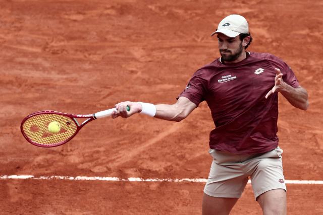 Monaco's Valentin Vacherot plays a forehand return to Australia's Alex De Minaur during the Monte Carlo ATP Masters Series Tournament quarter final tennis match on Court Rainier III at the Monte-Carlo Country Club in Roquebrune-Cap-Martin, south-eastern France on April 10, 2026. (Photo by Thibaud MORITZ / AFP)