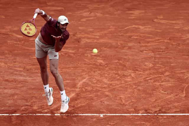 Monaco's Valentin Vacherot serves to Australia's Alex De Minaur during the Monte Carlo ATP Masters Series Tournament quarter final tennis match on Court Rainier III at the Monte-Carlo Country Club in Roquebrune-Cap-Martin, south-eastern France on April 10, 2026. (Photo by Thibaud MORITZ / AFP)