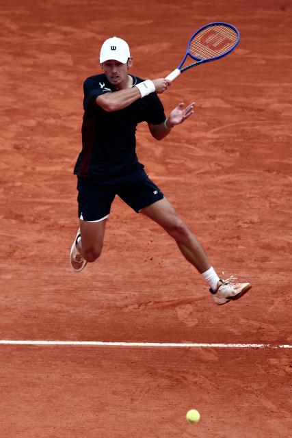 Australia's Alex De Minaur plays a forehand return to Monaco's Valentin Vacherot during the Monte Carlo ATP Masters Series Tournament quarter final tennis match on Court Rainier III at the Monte-Carlo Country Club in Roquebrune-Cap-Martin, south-eastern France on April 10, 2026. (Photo by Thibaud MORITZ / AFP)