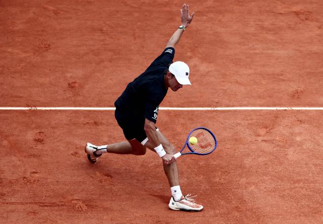 Australia's Alex De Minaur plays a backhand return to Monaco's Valentin Vacherot during the Monte Carlo ATP Masters Series Tournament quarter final tennis match on Court Rainier III at the Monte-Carlo Country Club in Roquebrune-Cap-Martin, south-eastern France on April 10, 2026. (Photo by Thibaud MORITZ / AFP)