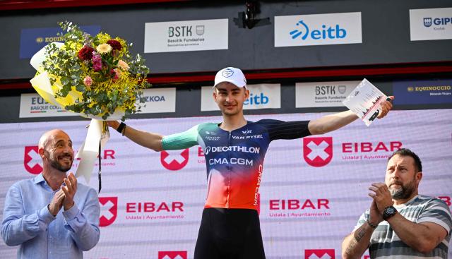 Team Decathlon CMA CGM's French rider Paul Seixas celebrates on the podium after winning the fifth stage of the Basque Country's Itzulia cycling tour, a 176.2 km race starting and finishing in Eibar, on April 10, 2026. Seixas is the overall race leader. (Photo by ANDER GILLENEA / AFP)