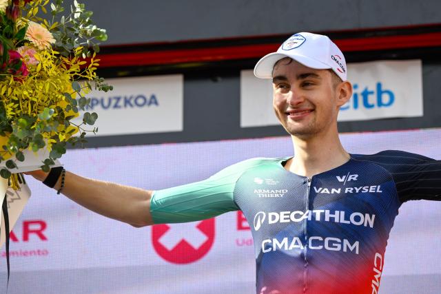 Team Decathlon CMA CGM's French rider Paul Seixas celebrates on the podium after winning the fifth stage of the Basque Country's Itzulia cycling tour, a 176.2 km race starting and finishing in Eibar, on April 10, 2026. Seixas is the overall race leader. (Photo by ANDER GILLENEA / AFP)
