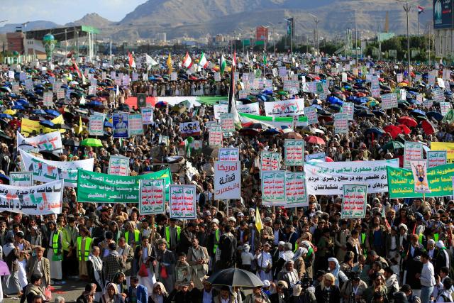 Supporters of the Iran-backed Houthi movement march in solidarity with Iran and Lebanon in the Yemeni capital Sanaa on April 10, 2026. Pakistan was poised on April 10, to host Iranian and US delegations for negotiations in its capital, although Tehran's participation remained uncertain after deadly Israeli strikes on Lebanon threatened this week's temporary truce. (Photo by Mohammed HUWAIS / AFP)
