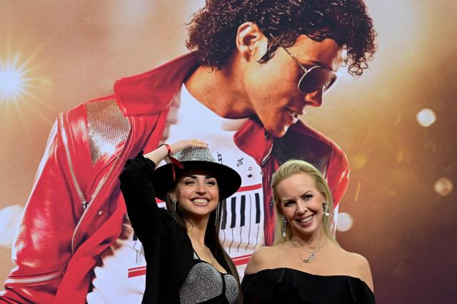 Swedish dancer Isabel Edvardsson (R) and Russian dancer Ekaterina Leonova pose for photogaphers as they arrive on the red carptet for the world premiere of the Michael Jackson biopic "Michael" at the Uber Eats Music Hall in Berlin on April 10, 2026. Thousands of Michael Jackson fans converged on April 10, 2026 to Berlin before the world premiere of the biopic on the king of pop, despite the accusations of paedophilia that still target the artist. (Photo by John MACDOUGALL / AFP)