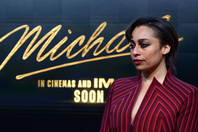 British singer Celeste poses for photogaphers as she arrive on the red carptet for the world premiere of the Michael Jackson biopic "Michael" at the Uber Eats Music Hall in Berlin on April 10, 2026. Thousands of Michael Jackson fans converged on April 10, 2026 to Berlin before the world premiere of the biopic on the king of pop, despite the accusations of paedophilia that still target the artist. (Photo by John MACDOUGALL / AFP)