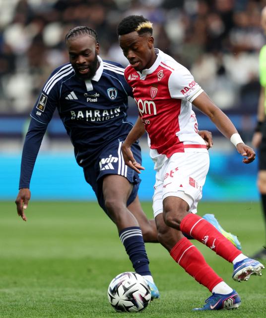 Paris FC's French midfielder #93 Jonathan Ikone (L) fights for the ball with Monaco's Ivorian forward #24 Simon Adingra (R) during the French L1 football match between Paris FC and AS Monaco at the Stade Jean-Bouin in Paris on April 10, 2026. (Photo by FRANCK FIFE / AFP)