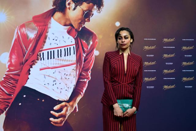 British singer Celeste poses for photogaphers as she arrive on the red carptet for the world premiere of the Michael Jackson biopic "Michael" at the Uber Eats Music Hall in Berlin on April 10, 2026. Thousands of Michael Jackson fans converged on April 10, 2026 to Berlin before the world premiere of the biopic on the king of pop, despite the accusations of paedophilia that still target the artist. (Photo by John MACDOUGALL / AFP)